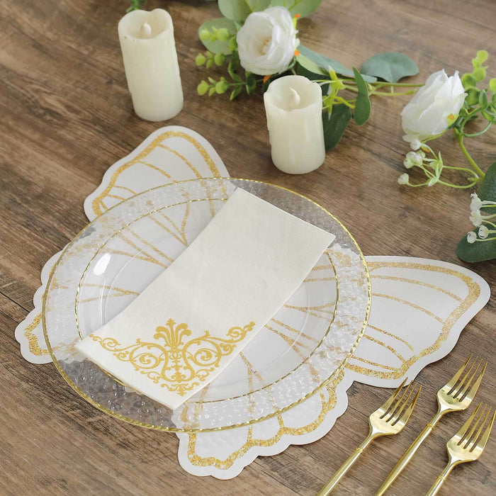 Butterfly-shaped placemat with clear plate and gold accents on a rustic table setting.