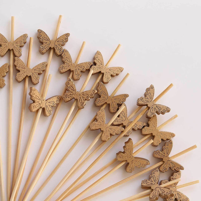 Wooden butterfly cake toppers on skewers, perfect for celebrations.
