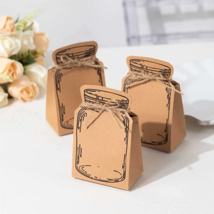 Brown paper gift bags with jar design and twine accents on a table.