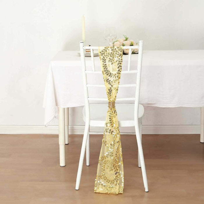 Gold sequin table runner draped on a white chair in a dining setting.