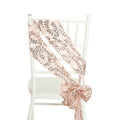 Pink and gold sequin chair sash draped on a white chair
