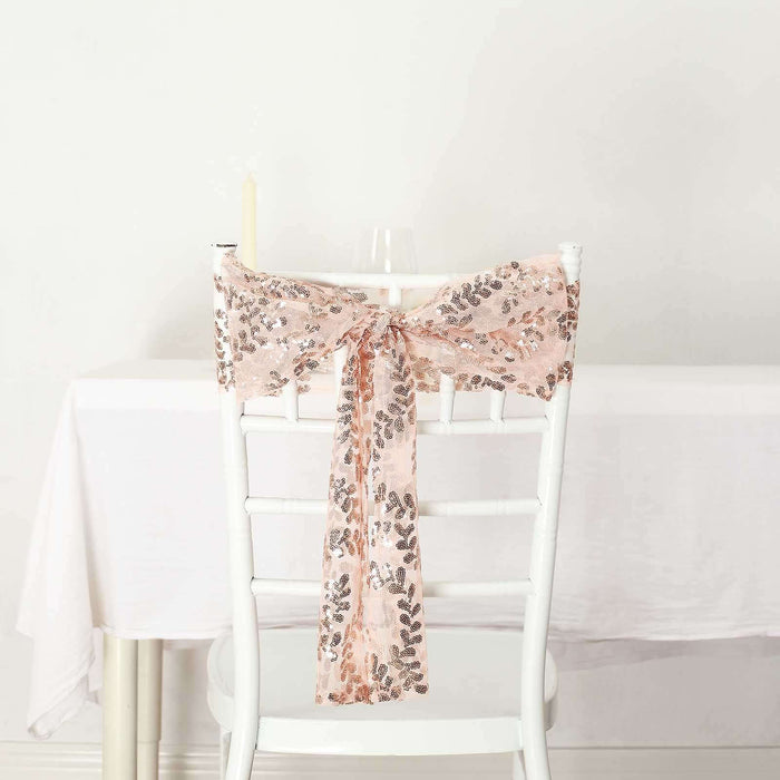 Rose gold sequin chair sash tied on a white chair.