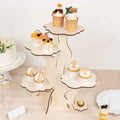 Cupcake stand displaying decorated cupcakes and desserts for a celebration.