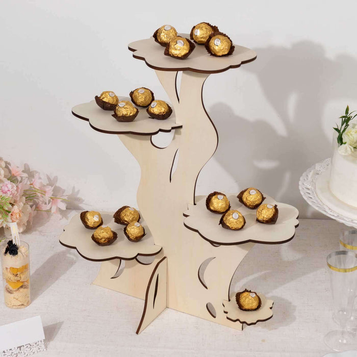 Wooden dessert stand displaying Ferrero Rocher chocolates at an event.