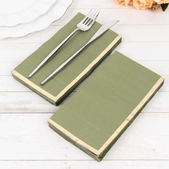 Green napkins with cream trim, arranged with a fork and knife.