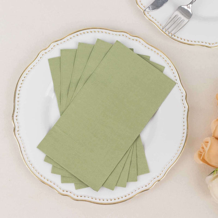 Set of green napkins on an elegant plate.