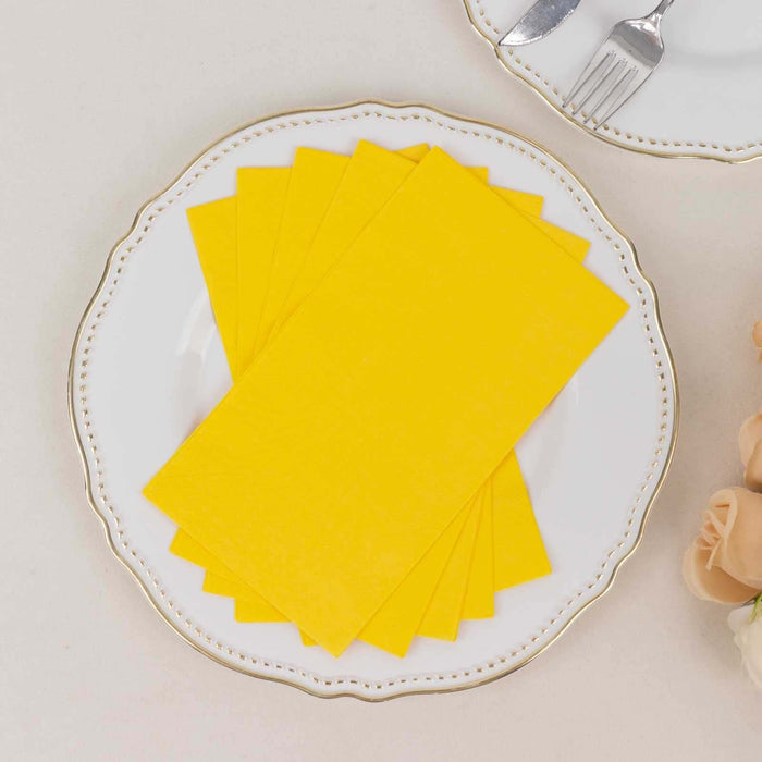 Yellow paper sheets stacked on an elegant plate.