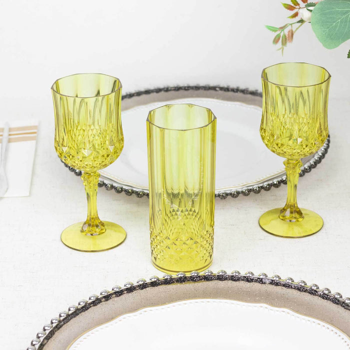 Yellow glassware set on a decorative table setting.