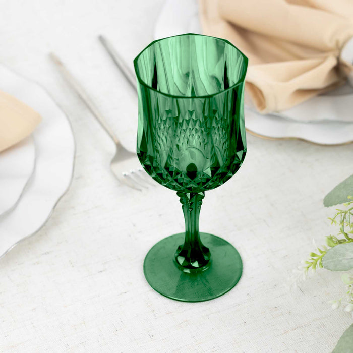 Green decorative glass goblet on a table setting.