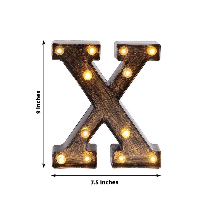 Illuminated vintage-style letter "X" marquee light, 9 inches tall and 7.5 inches wide.