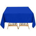 Blue tablecloth draped over a wooden table.