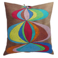 A linen pillow with a colorful geometric pattern and leather tie closure on white background. Designed by Michele Varian and made in New York.